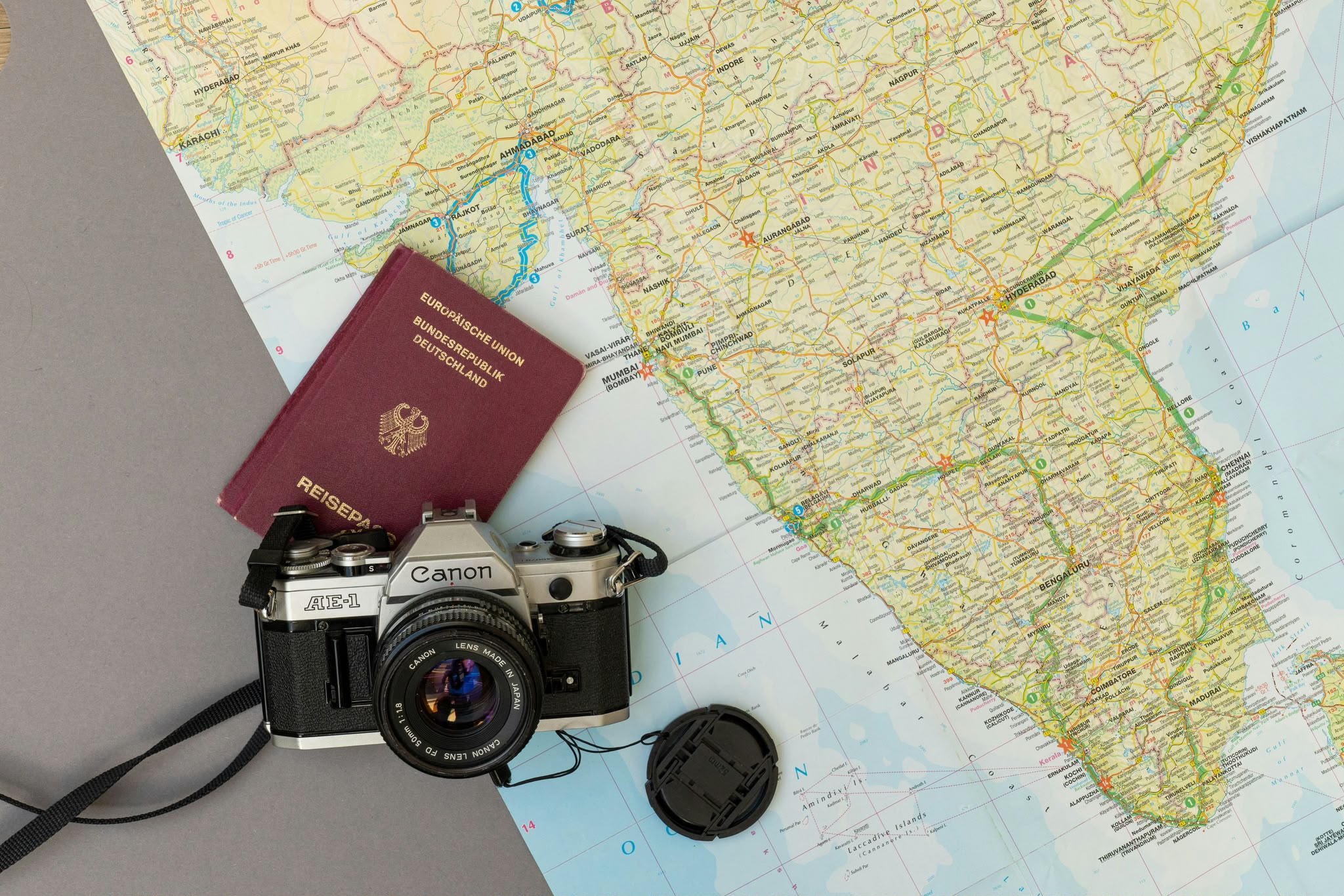 A passport resting on a travel map